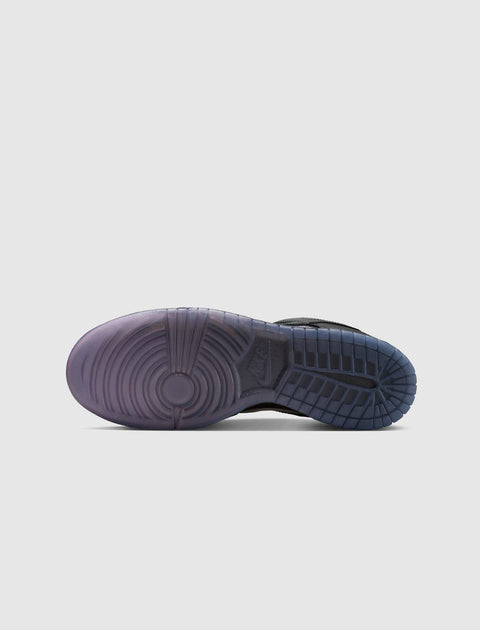 Translucent purple and blue rubber sneaker sole with traction pattern on white background