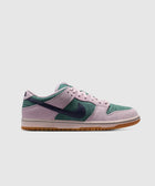 Low-top suede sneaker in pink, green, and navy with gum sole on white background