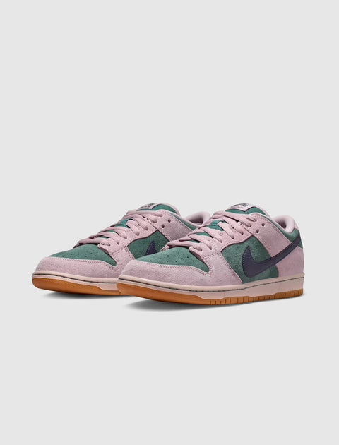 Pink and green suede low-top sneakers with gum soles on a white background