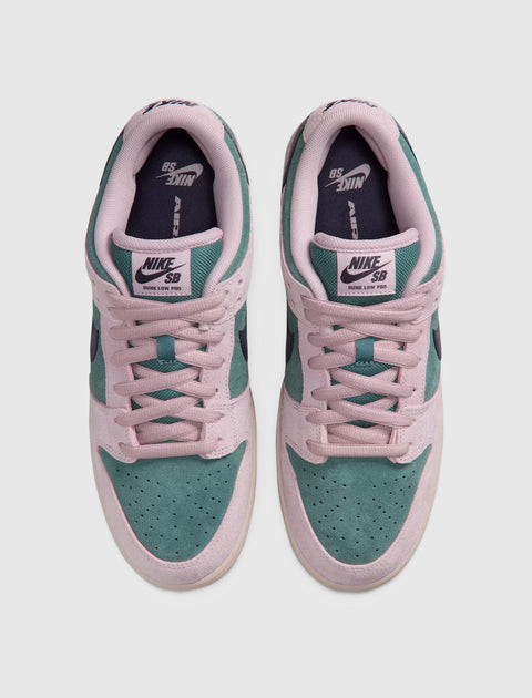 Nike SB Dunk Low Pro sneakers in teal and light pink suede, top view