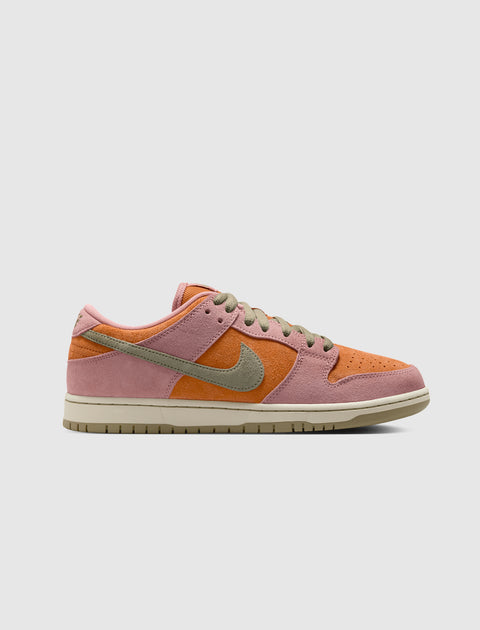 Low-top sneaker in pink, orange, and beige suede with olive green swoosh and laces