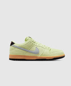 Side view of a light green suede low-top sneaker with grey swoosh and gum sole, men's streetwear