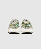 Rear view of woven multicolor sneakers with white soles and light grey heel, studio background