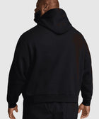 Man wearing a black hooded streetwear sweatshirt, back view, against a gray background.