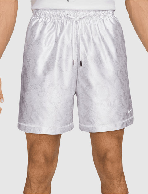 Men's light grey athletic shorts with subtle snakeskin pattern and drawstring waist