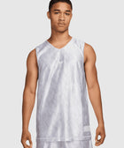 Man wearing a white patterned basketball jersey and matching shorts, front view