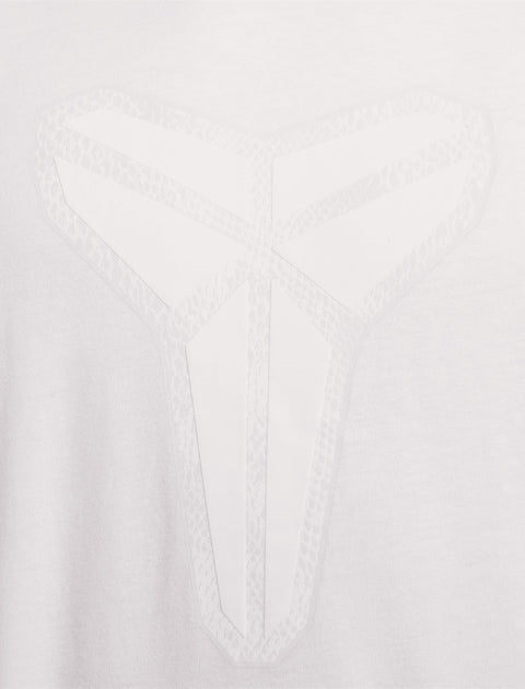 White fabric with a subtle geometric emblem and faint snakeskin texture detail.