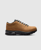 Low-top taupe sneaker with black sole, metal eyelets, and visible air cushioning, side view