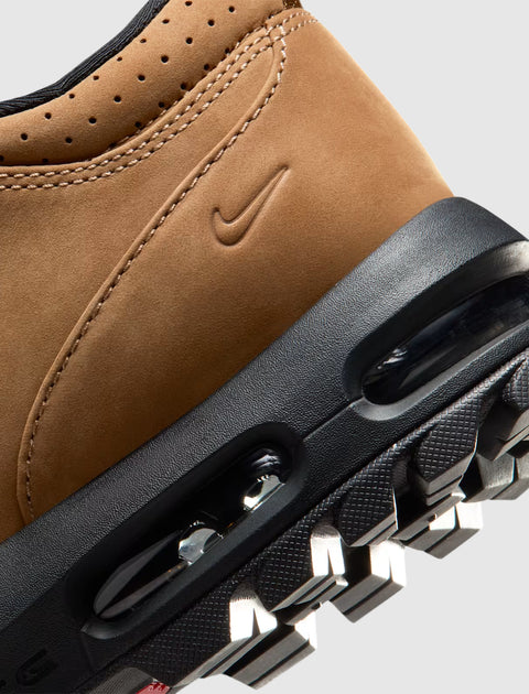 Close-up of tan leather sneaker heel with visible Air unit and treaded black sole