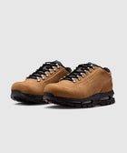 Men's low-top taupe hiking sneakers with black laces and rugged soles on white background