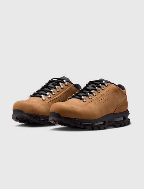 Men's low-top taupe hiking sneakers with black laces and rugged soles on white background