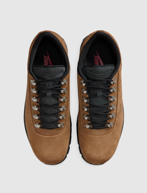 Brown suede low-top sneakers with black laces and metal eyelets, top view