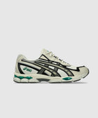 Men's pale oak running sneaker with black and green accents, side profile