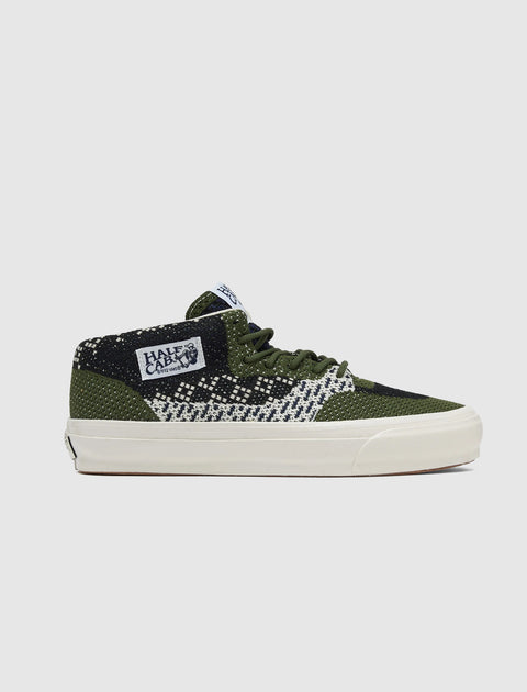 Green and black knit skate shoe with geometric check pattern and Half Cab label on side