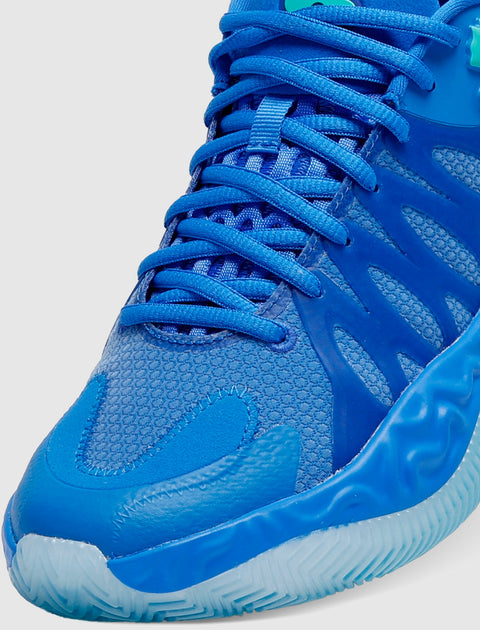 Close-up of blue athletic sneaker with mesh upper and textured rubber sole