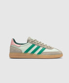 Mint green and beige sneaker with green stripes, pink heel accent, and gum sole on white background