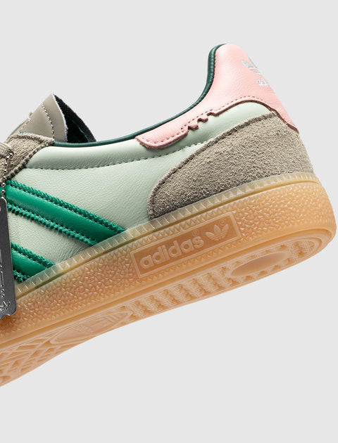 Mint green and pink Adidas sneaker with suede accents and gum sole, close-up side view