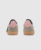 Back view mint green and pink sneakers with suede accents and gum soles against white background