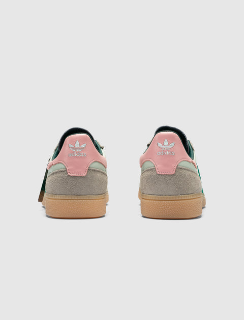 Back view mint green and pink sneakers with suede accents and gum soles against white background