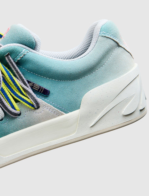 Streetwear sneaker in pastel blue, grey, and pink suede with multicolor laces on white sole