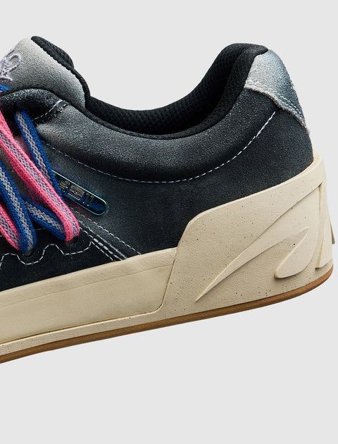 Close-up of men's sneaker heel in black and grey suede with cream sole and colorful laces