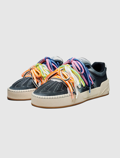 Men's streetwear sneakers with dark uppers, chunky beige soles, and multicolor laces
