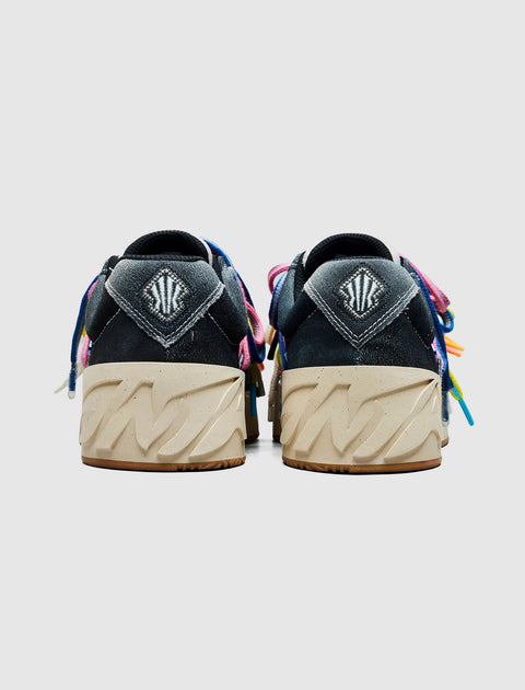 Rear view of multicolor streetwear sneakers with chunky beige soles and embroidered heel logos