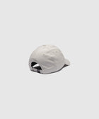 White cotton baseball cap with adjustable strap back, displayed on light background