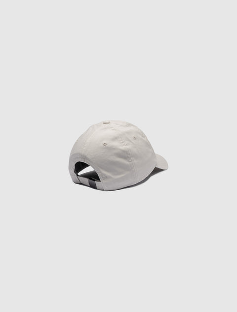 White cotton baseball cap with adjustable strap back, displayed on light background
