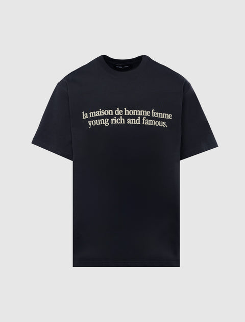 Black men's streetwear t-shirt with cream text reading 'la maison de homme femme young rich and famous.'