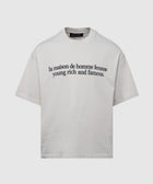 White streetwear t-shirt with black text graphic, relaxed fit, short sleeves, crew neck