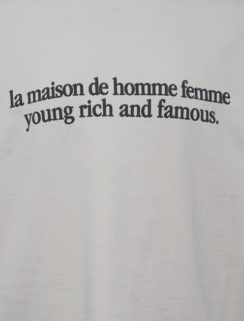 White streetwear t-shirt with black text 'la maison de homme femme young rich and famous' printed on front.