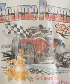 Graphic tee featuring vintage race car, checkered flags, floral details, distressed print