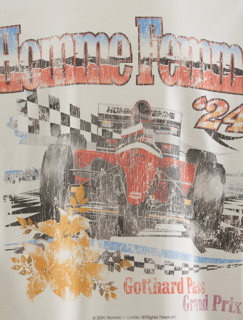 Graphic tee featuring vintage race car, checkered flags, floral details, distressed print