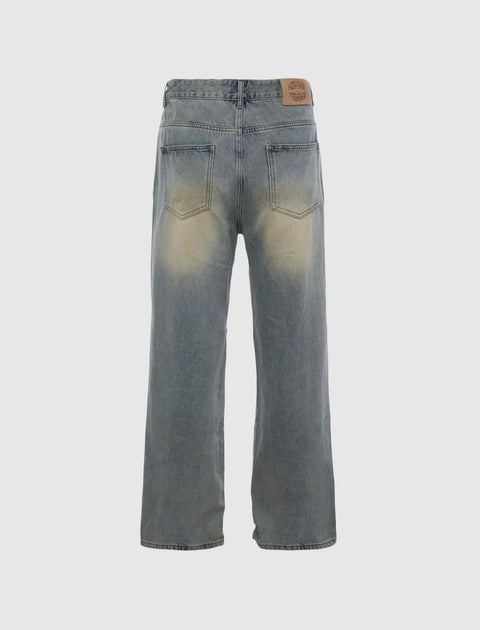 Back view of faded wide-leg denim jeans with rear pockets on white background
