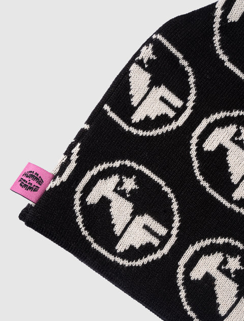 Black knit beanie with white graphic logos and a pink woven label, streetwear accessory