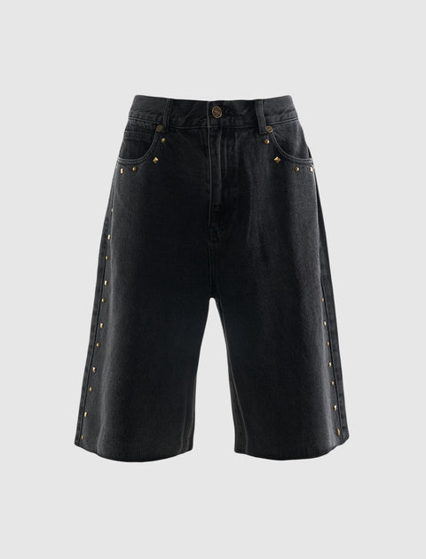 Black denim shorts with gold stud detailing on pockets and sides, streetwear style.