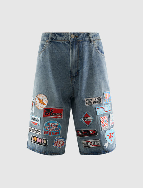 Men's denim shorts with multiple colorful embroidered patches, streetwear style