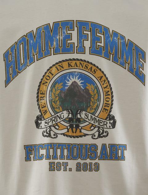 White streetwear t-shirt with blue and yellow graphic text and mountain crest detail.