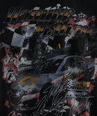 Graphic print of a race car, checkered flags, and cityscape on a black streetwear top