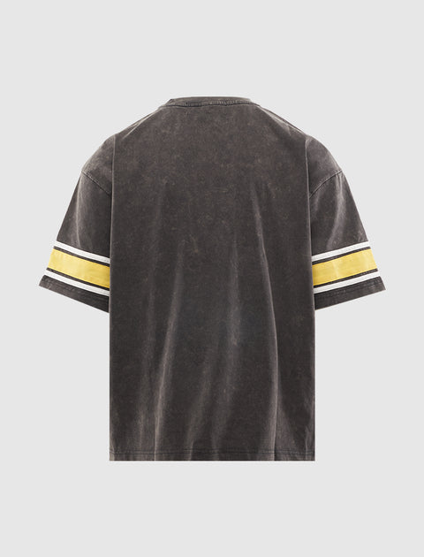 Back of a black washed streetwear T-shirt with yellow and white striped sleeves
