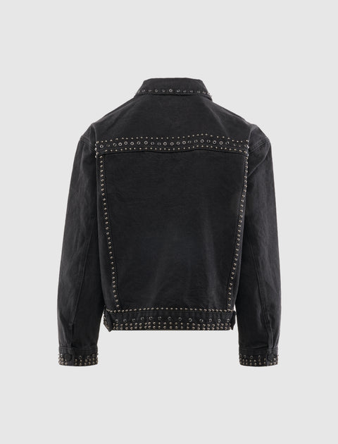 Back view of black denim jacket with metallic stud detailing on seams and cuffs