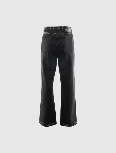 Back view of black studded men's denim jeans with straight leg and silver detailing