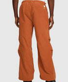 Back view of men's orange wide-leg pants with elastic waistband, streetwear style