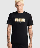 Man wearing a black graphic tee with 'AIR' and swoosh, streetwear style, tattooed arms