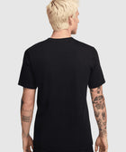 Back view of man in black short sleeve streetwear t-shirt with visible arm tattoos