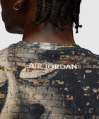 Back of men's graphic t-shirt with 'Air Jordan' text and brick wall pattern