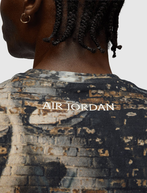 Back of men's graphic t-shirt with 'Air Jordan' text and brick wall pattern