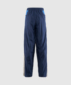 Men's blue nylon track pants with elastic waistband and side panels, rear view
