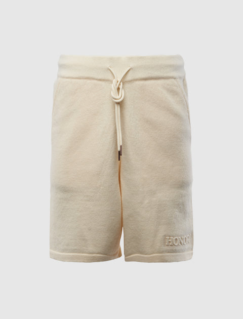 Cream fleece men's streetwear shorts with drawstring waist and 'HONOR' embroidered on leg